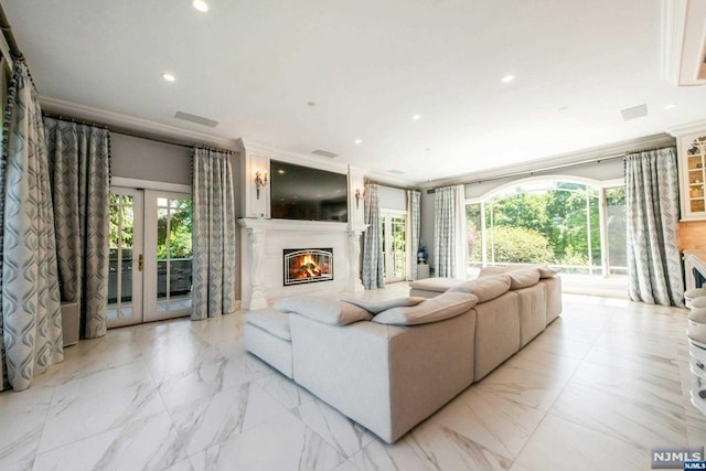 living room with ornamental molding and french doors