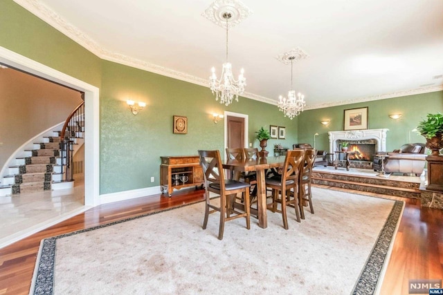 dining room featuring crown molding and hardwood / wood-style flooring