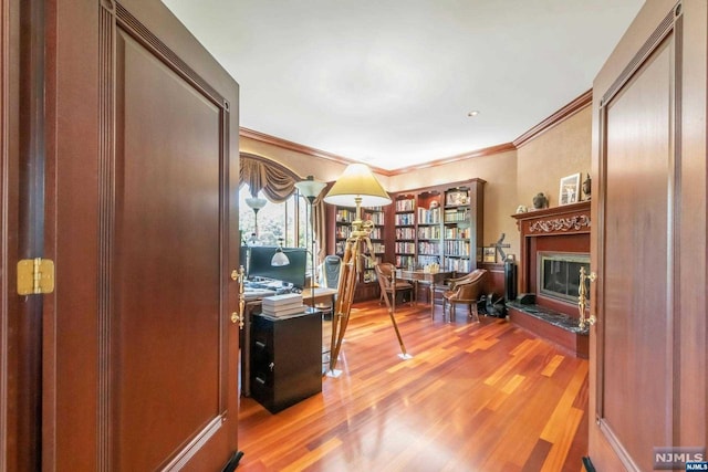 office space featuring ornamental molding and light wood-type flooring