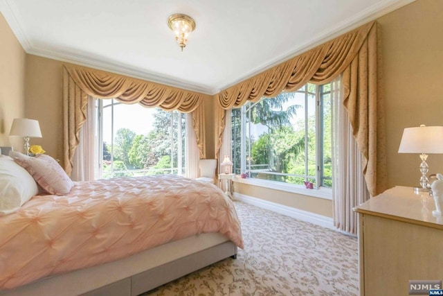 bedroom featuring light colored carpet and ornamental molding