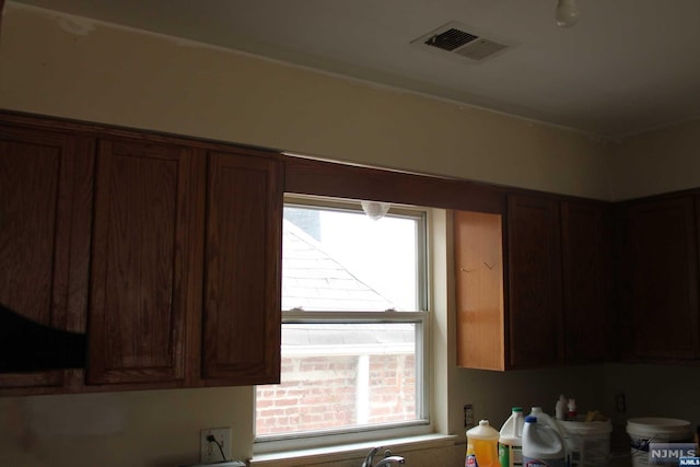 kitchen with ventilation hood and a wealth of natural light