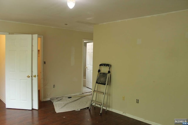 spare room featuring dark hardwood / wood-style floors