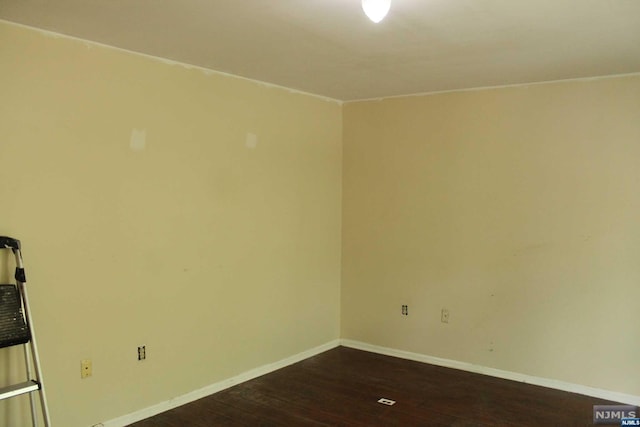 unfurnished room featuring wood-type flooring