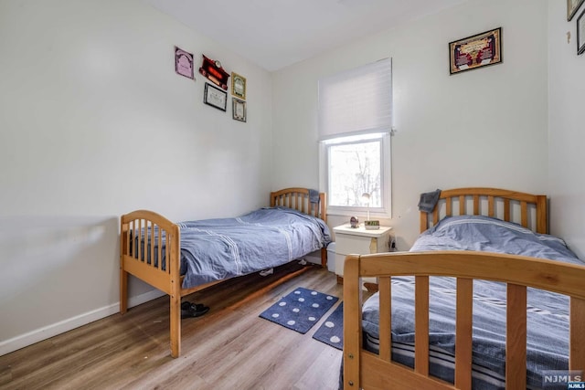 bedroom featuring hardwood / wood-style floors