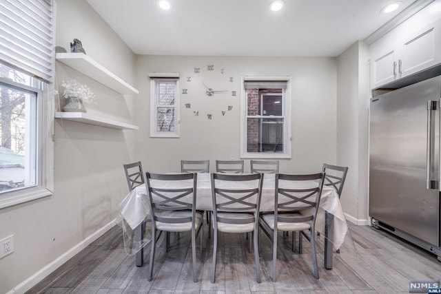 dining room with light hardwood / wood-style flooring