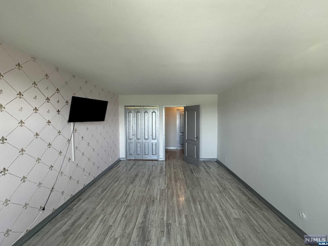 spare room featuring hardwood / wood-style flooring