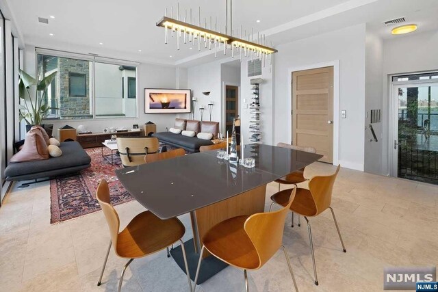 dining space with light tile patterned floors