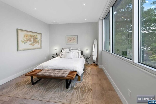 bedroom with light hardwood / wood-style flooring