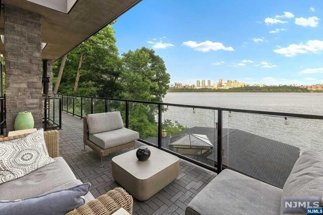 balcony featuring a water view