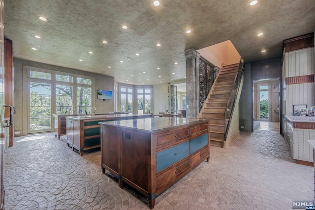 kitchen featuring a large island and sink