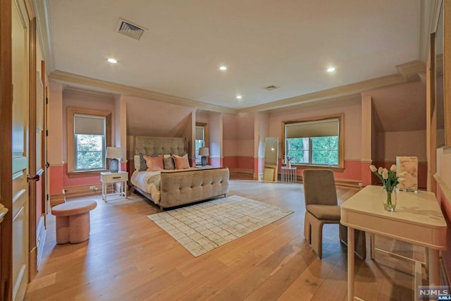 bedroom with multiple windows, light hardwood / wood-style flooring, and ornamental molding