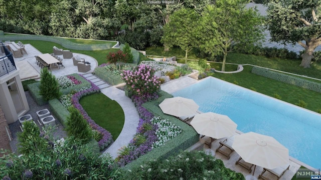 view of swimming pool featuring a yard and a patio