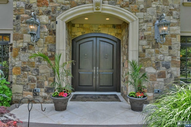 entrance to property featuring french doors