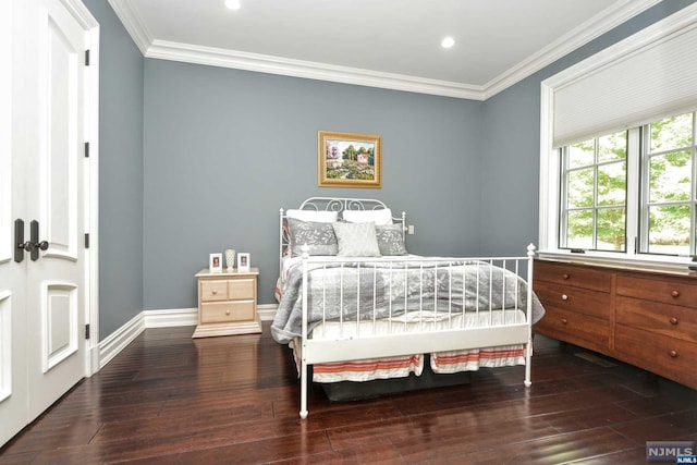 bedroom featuring hardwood / wood-style floors and ornamental molding