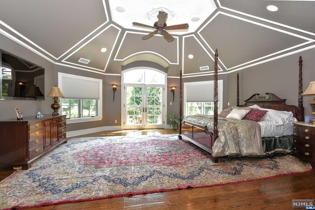 bedroom with ceiling fan, french doors, and wood-type flooring