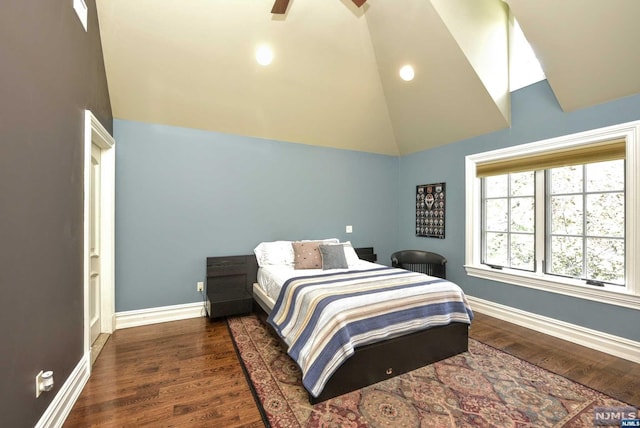 bedroom featuring ceiling fan, dark wood-type flooring, and high vaulted ceiling