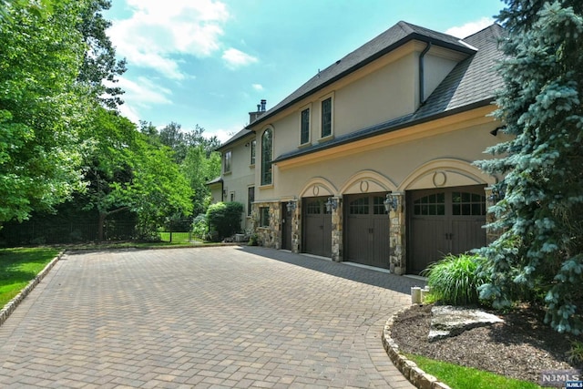 view of side of property with a garage