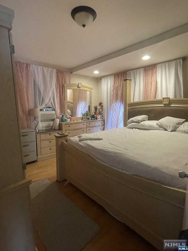 bedroom featuring light wood-type flooring