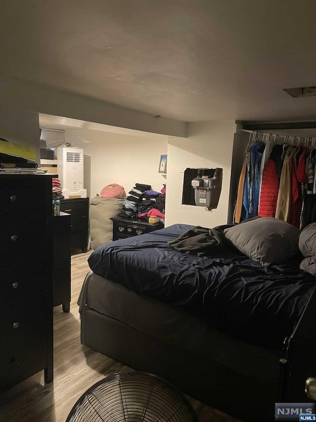 bedroom with light hardwood / wood-style flooring