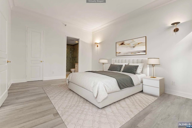 bedroom with crown molding and light hardwood / wood-style floors