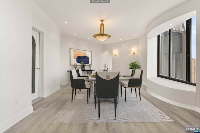 dining space featuring light hardwood / wood-style flooring