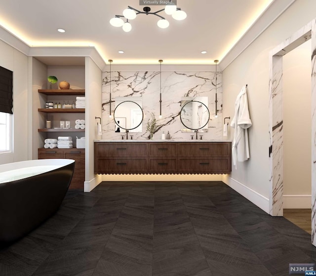 bathroom featuring vanity and a tub