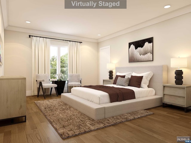 bedroom with wood-type flooring and crown molding