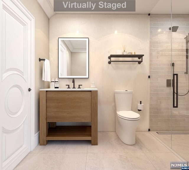 bathroom featuring tile patterned flooring, vanity, toilet, and walk in shower