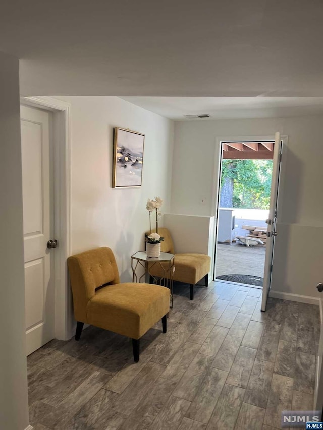 living area with dark hardwood / wood-style flooring