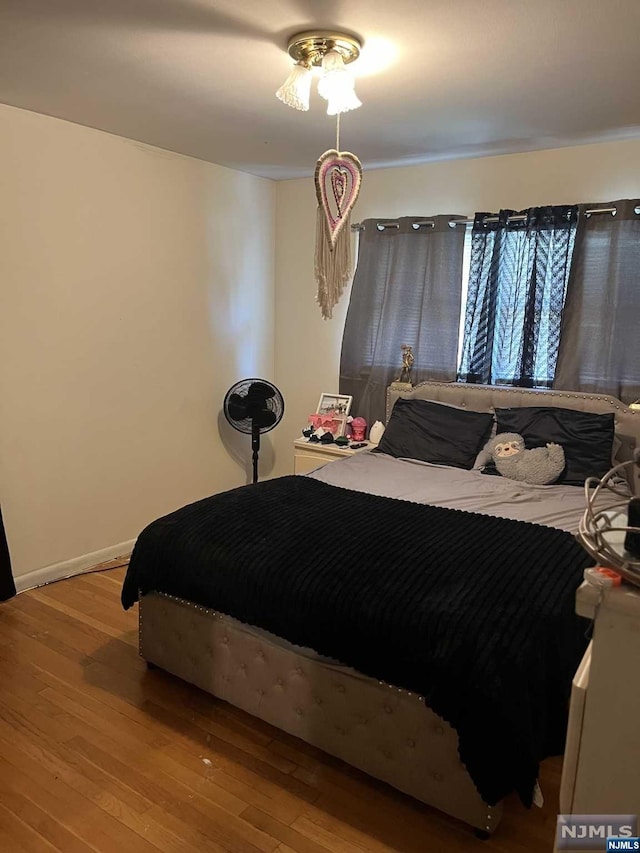 bedroom with wood-type flooring