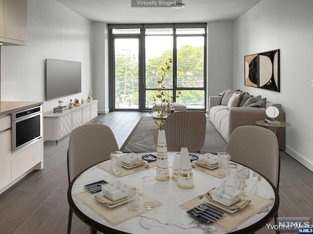 dining area featuring floor to ceiling windows and dark wood-type flooring