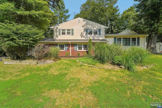 rear view of house with a lawn