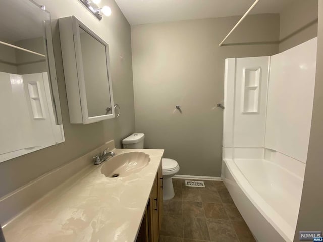 full bathroom featuring shower / tub combination, vanity, and toilet