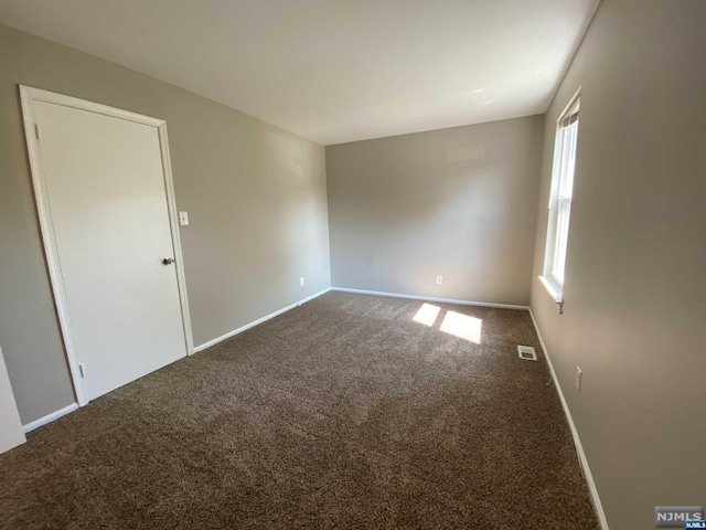 empty room with carpet flooring