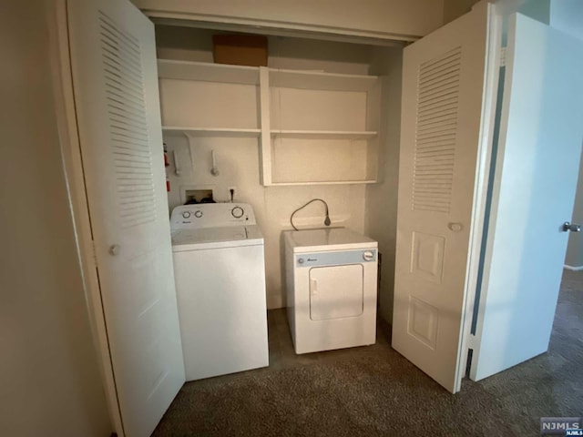 laundry area featuring washer and dryer and dark carpet