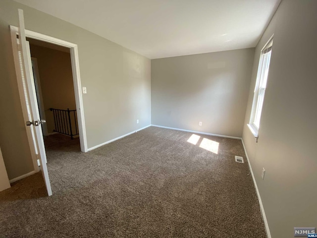 view of carpeted spare room