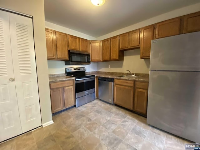 kitchen with appliances with stainless steel finishes and sink