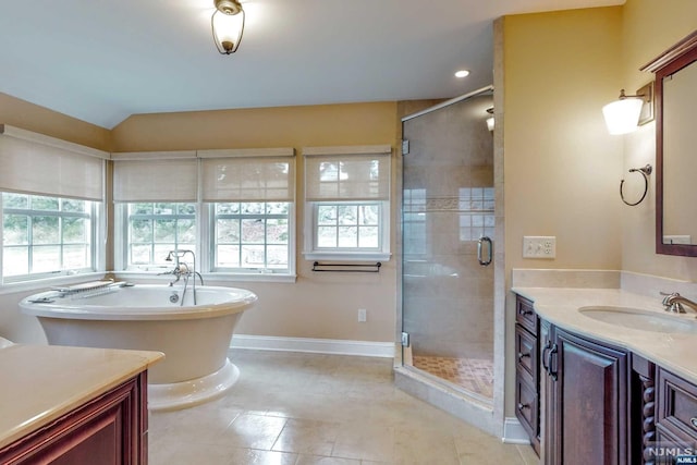 bathroom featuring tile patterned flooring, vanity, and independent shower and bath