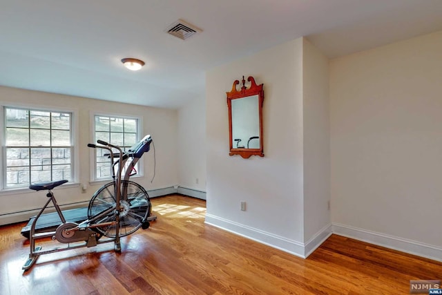 workout room featuring hardwood / wood-style floors