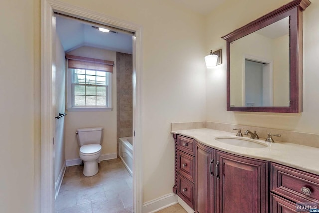 full bathroom featuring tile patterned floors, vanity, toilet, and tiled shower / bath combo