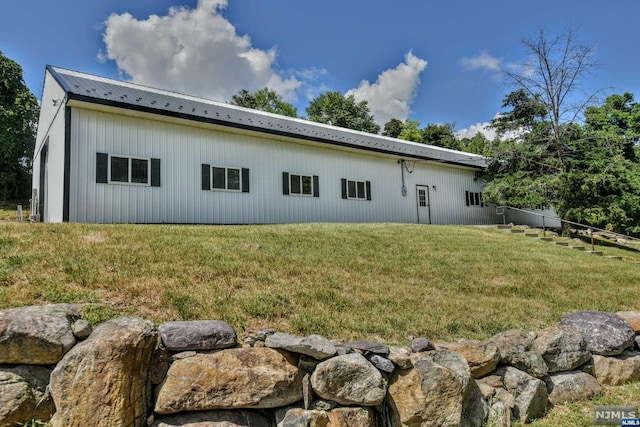 view of property exterior featuring a yard