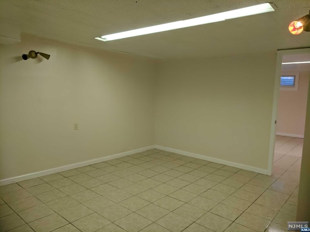 unfurnished room featuring light tile patterned floors