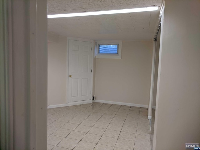 unfurnished room featuring light tile patterned floors