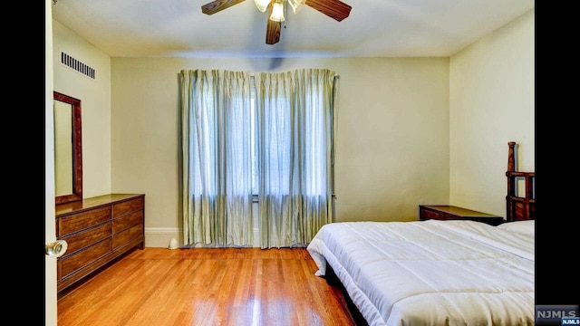 bedroom featuring ceiling fan and light hardwood / wood-style flooring