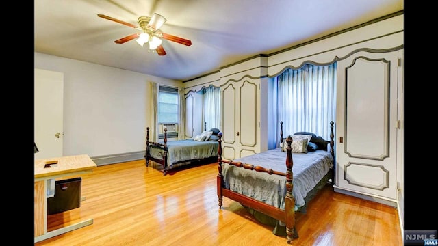 bedroom featuring ceiling fan and wood-type flooring