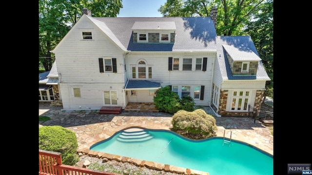 rear view of house featuring a patio