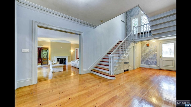 interior space featuring crown molding and hardwood / wood-style flooring