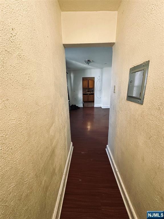 hallway featuring dark wood-type flooring