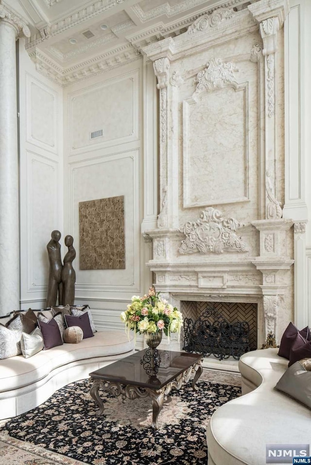 sitting room featuring ornamental molding