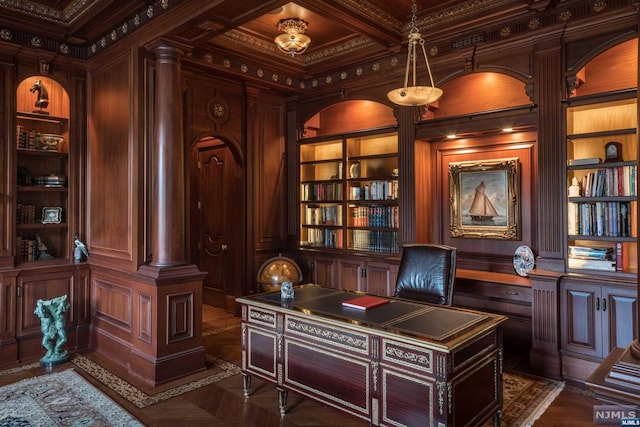 office featuring built in shelves, wooden walls, coffered ceiling, and ornamental molding